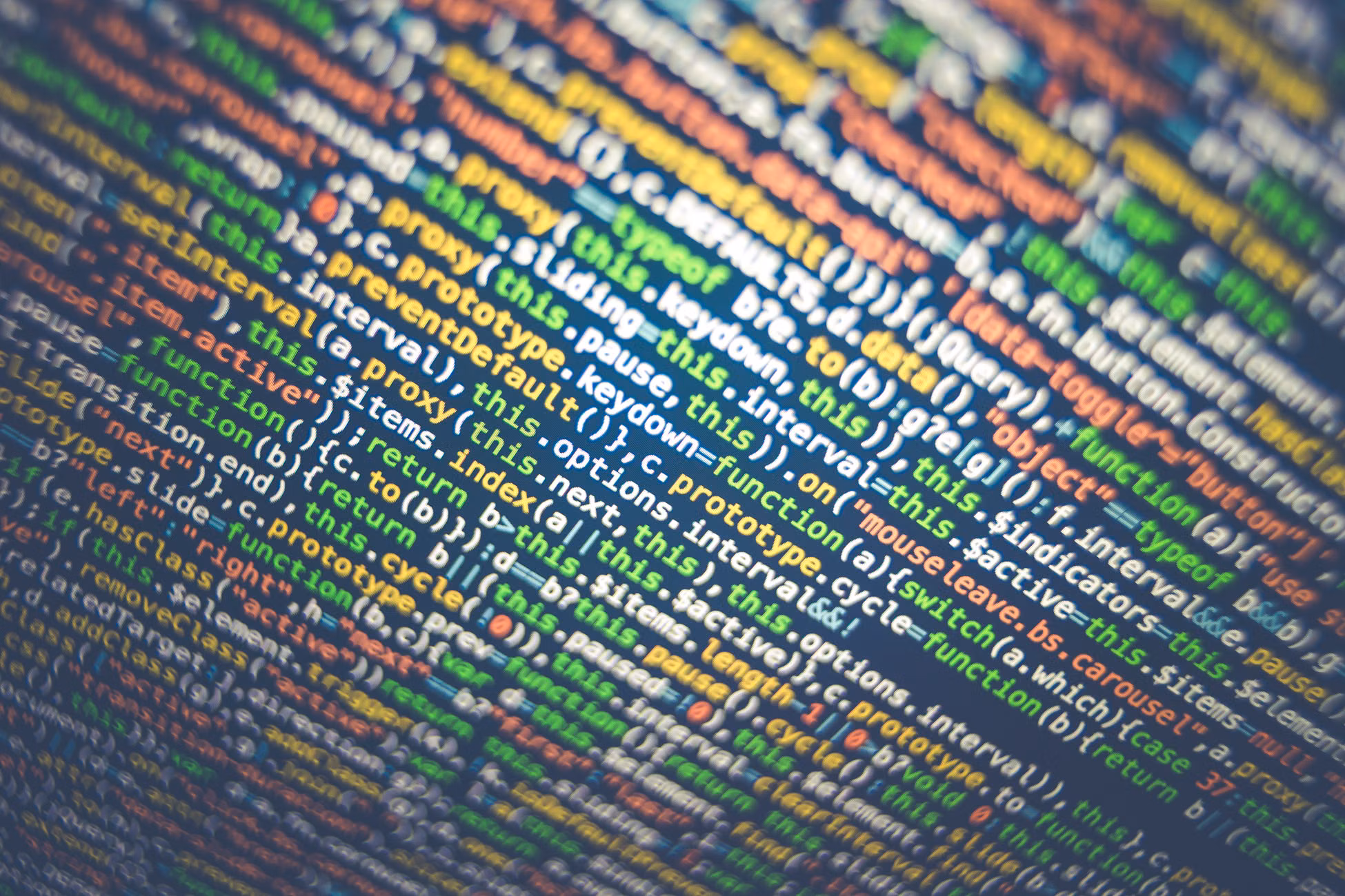 Vibrant multicolored source code displayed on a computer screen, depicting programming and web development concepts.